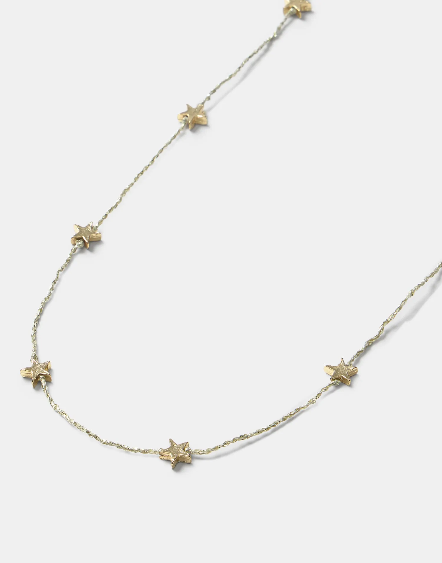 Collar hilo estrellas doradas